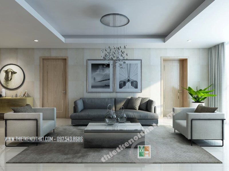 Bộ sofa bọc vải đẹp với chiếc ghế sofa dài màu xám và hai ghế đơn màu xám tạo điểm nhấn nổi bật cho phòng khách chung cư